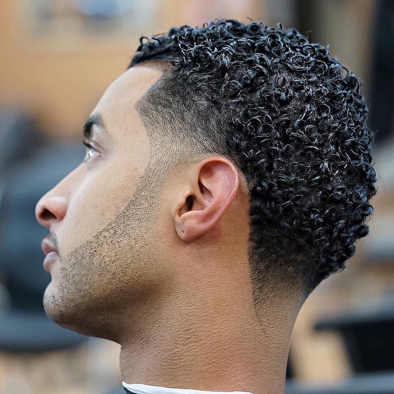 Curly hair with taper fade