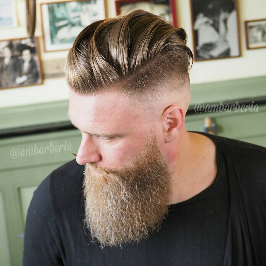 Long hair slicked back undercut with high skin fade and beard