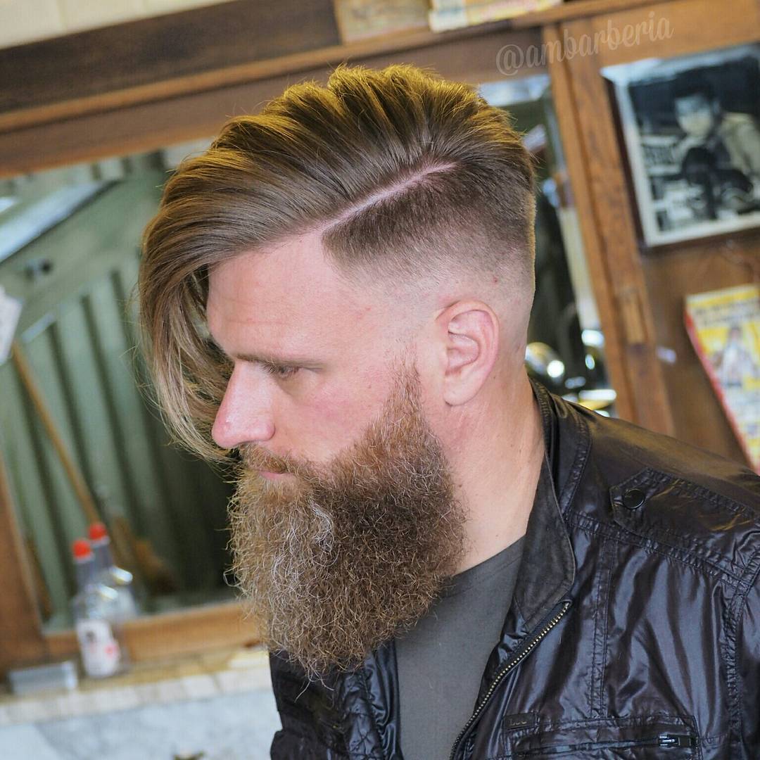 Undercut haircut for men with long hair and disconnected full beard