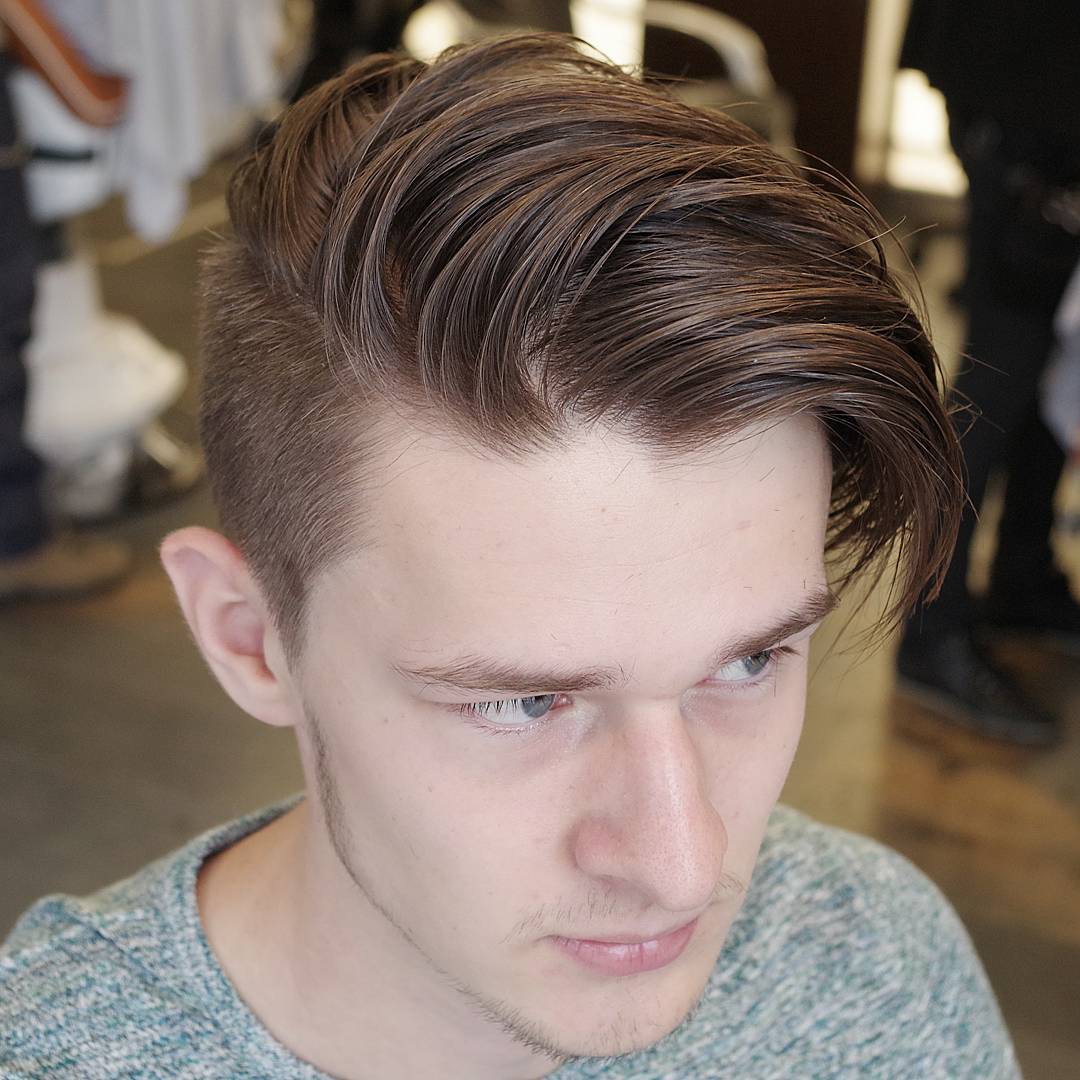 Undercut hairstyle for men with long side swept fringe