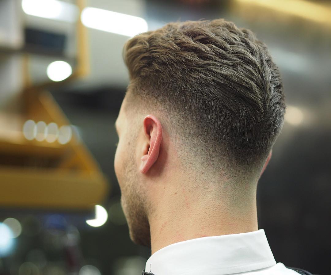 Thick hair haircut for men with low fade