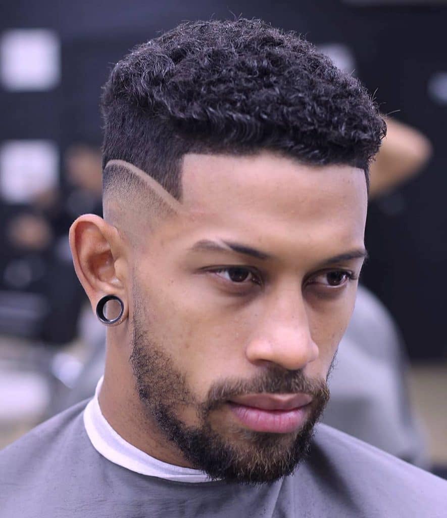 Curly Taper Fade  This messy curled hairstyle is also finished with a  fade on the sides  Men haircut curly hair Mens curly hairstyles  Haircuts for curly hair
